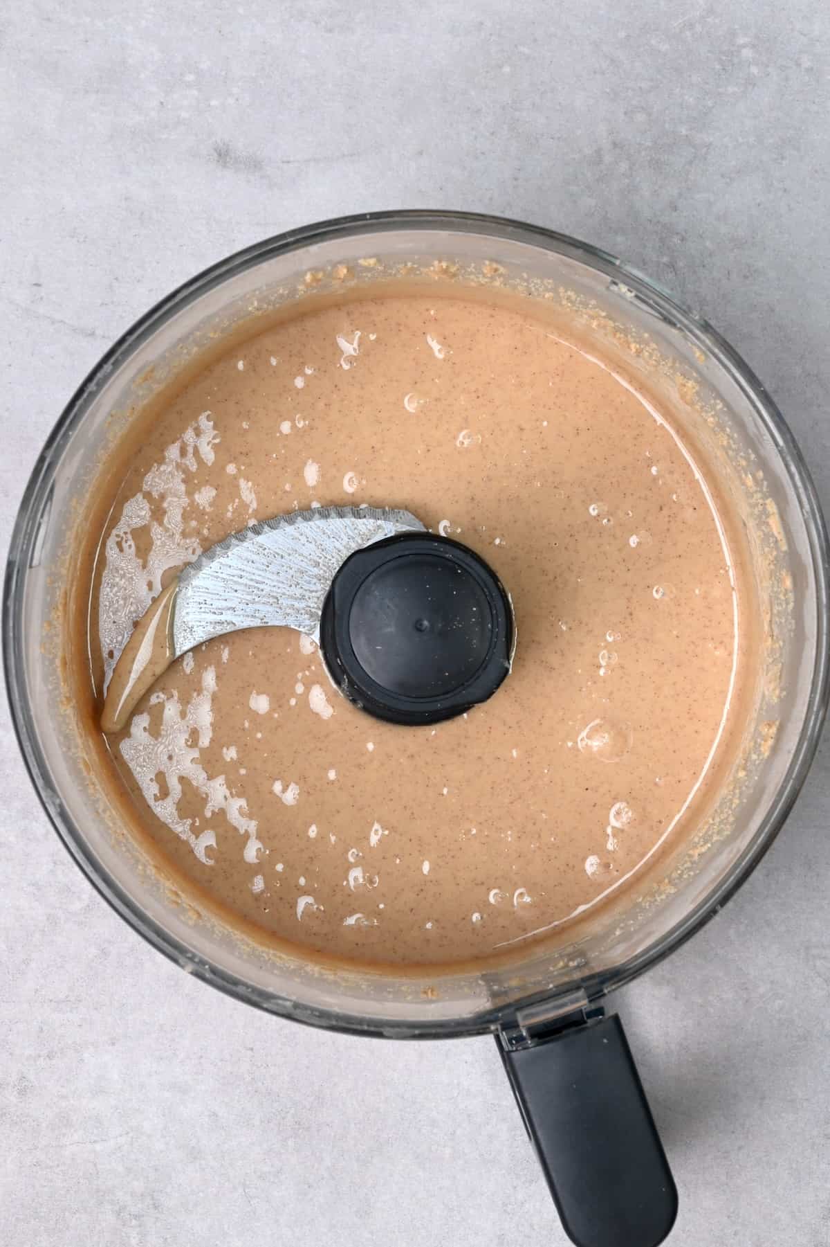 Homemade peanut butter in a food processor