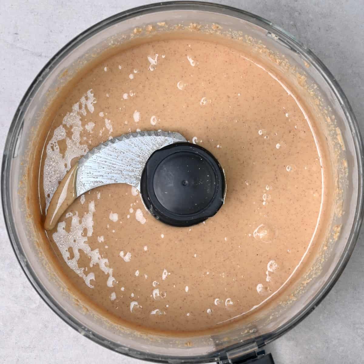 Homemade peanut butter in a food processor