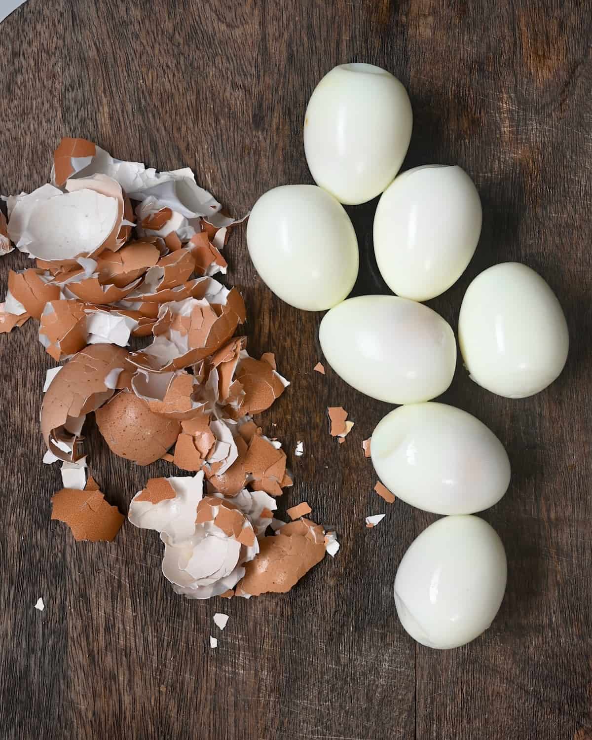 Peeled hard boiled eggs on a cutting board