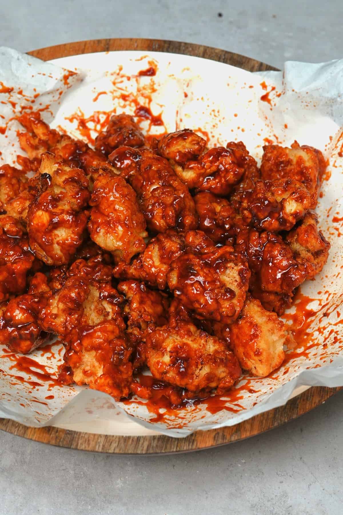 Fried chicken covered with red chili sauce