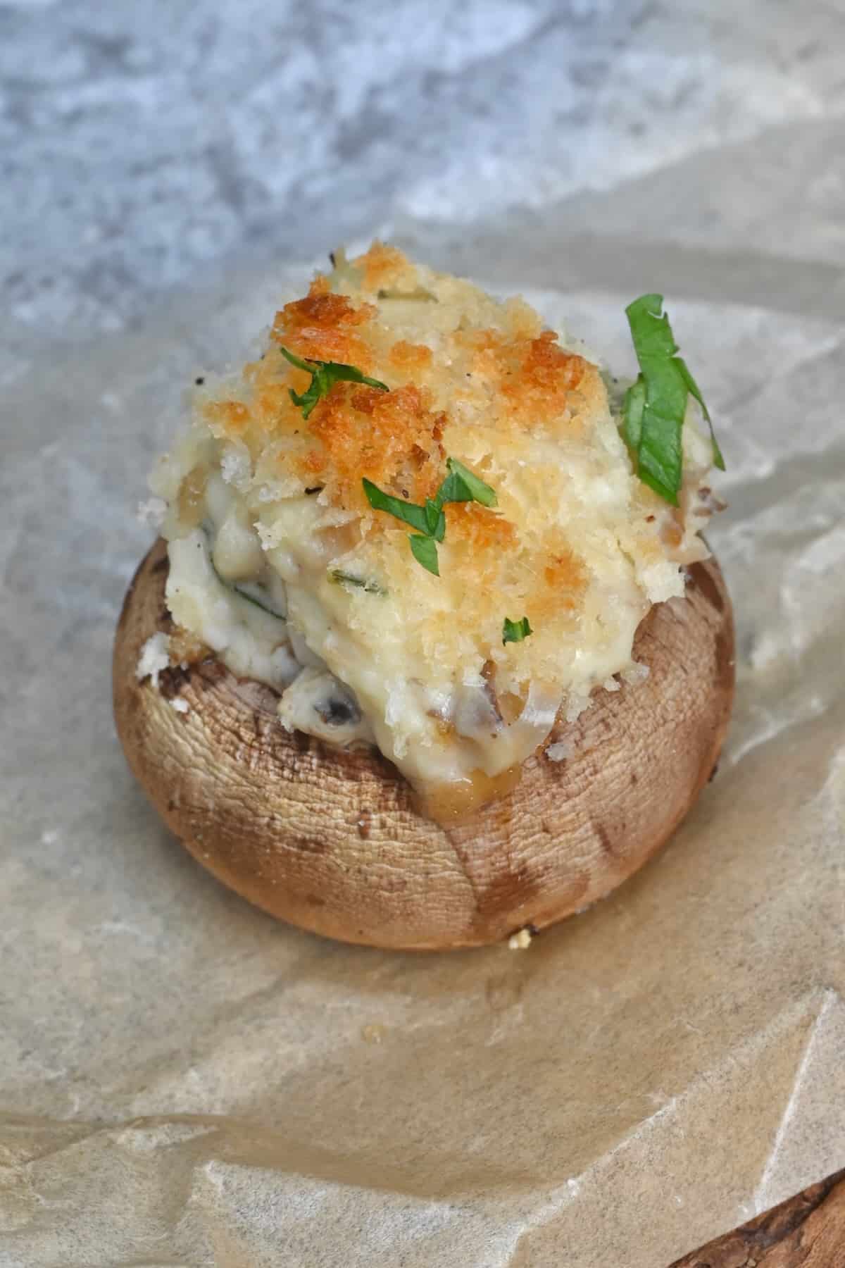 Stuffed mushroom topped with parmesan and breadcrumbs