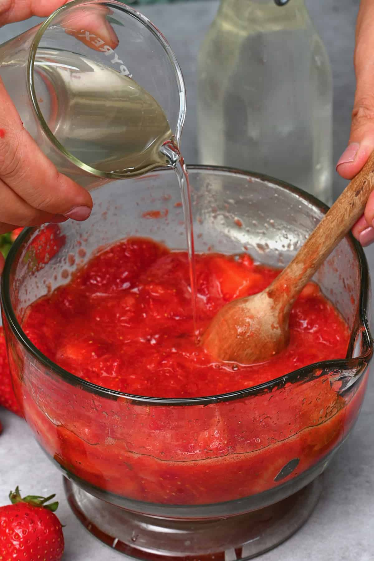 Adding simple syrup to strawberry puree