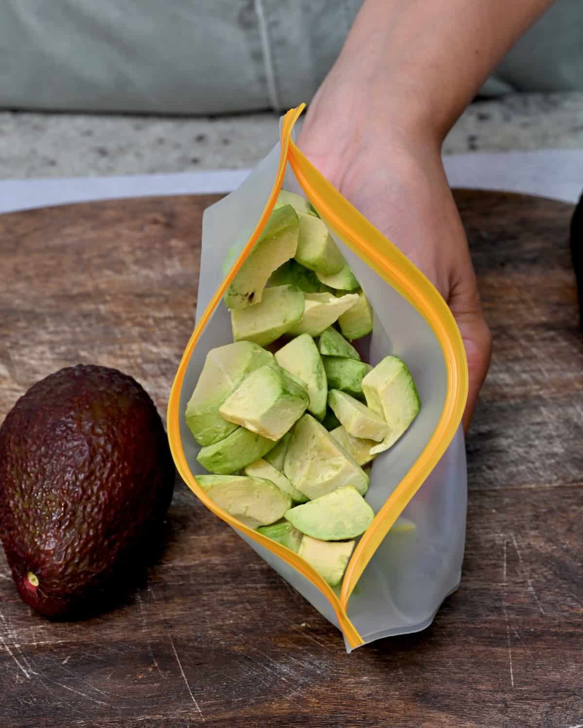 Frozen avocado chunks in a reusable freezer bag
