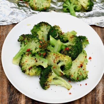 A serving of grilled broccoli topped with chili flakes
