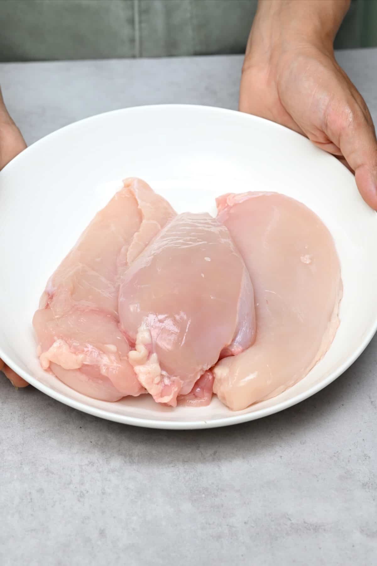 A bowl with chicken breasts
