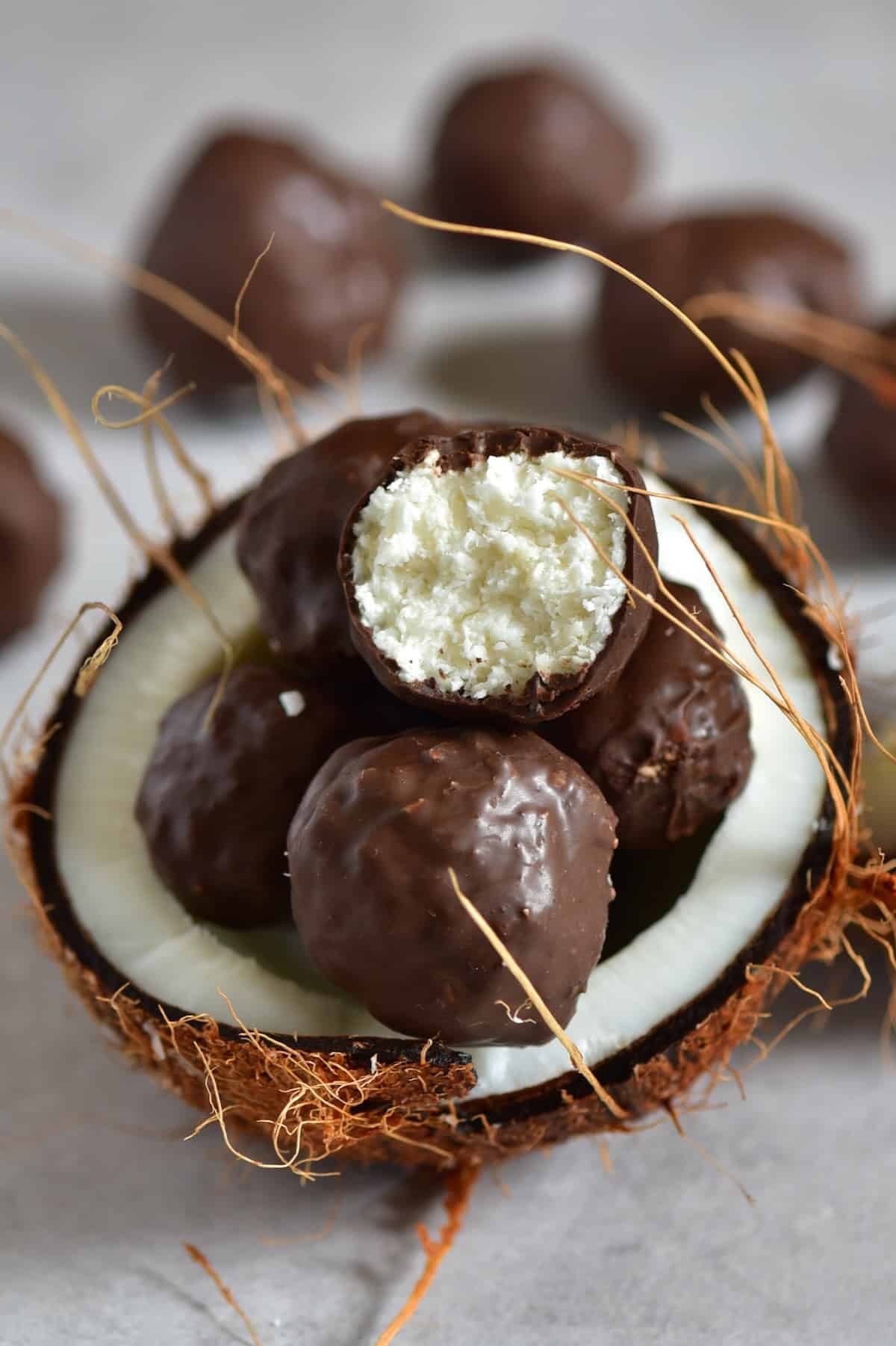 Chocolate coconut balls in an open coconut