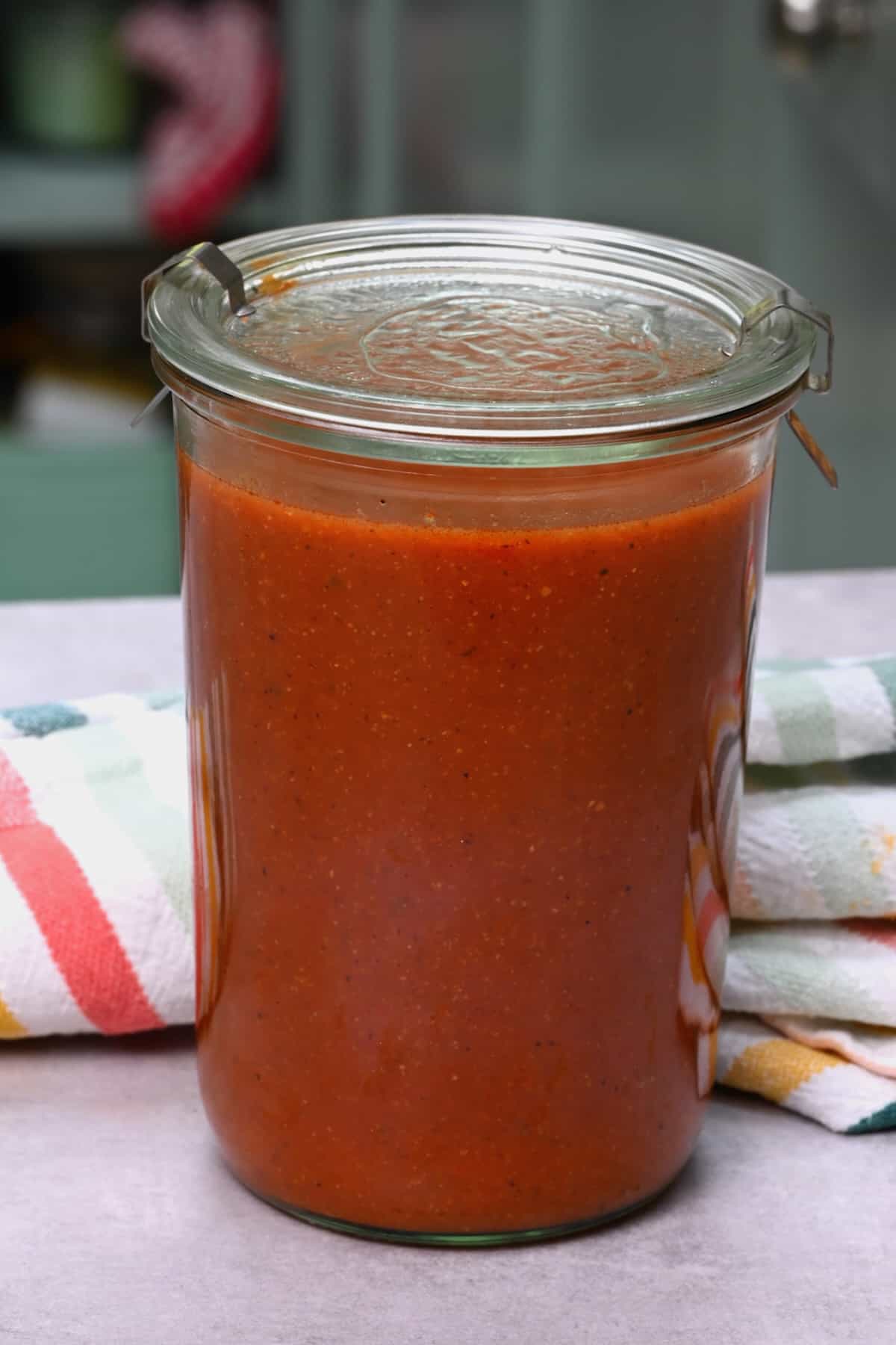 Homemade enchilada sauce in a jar