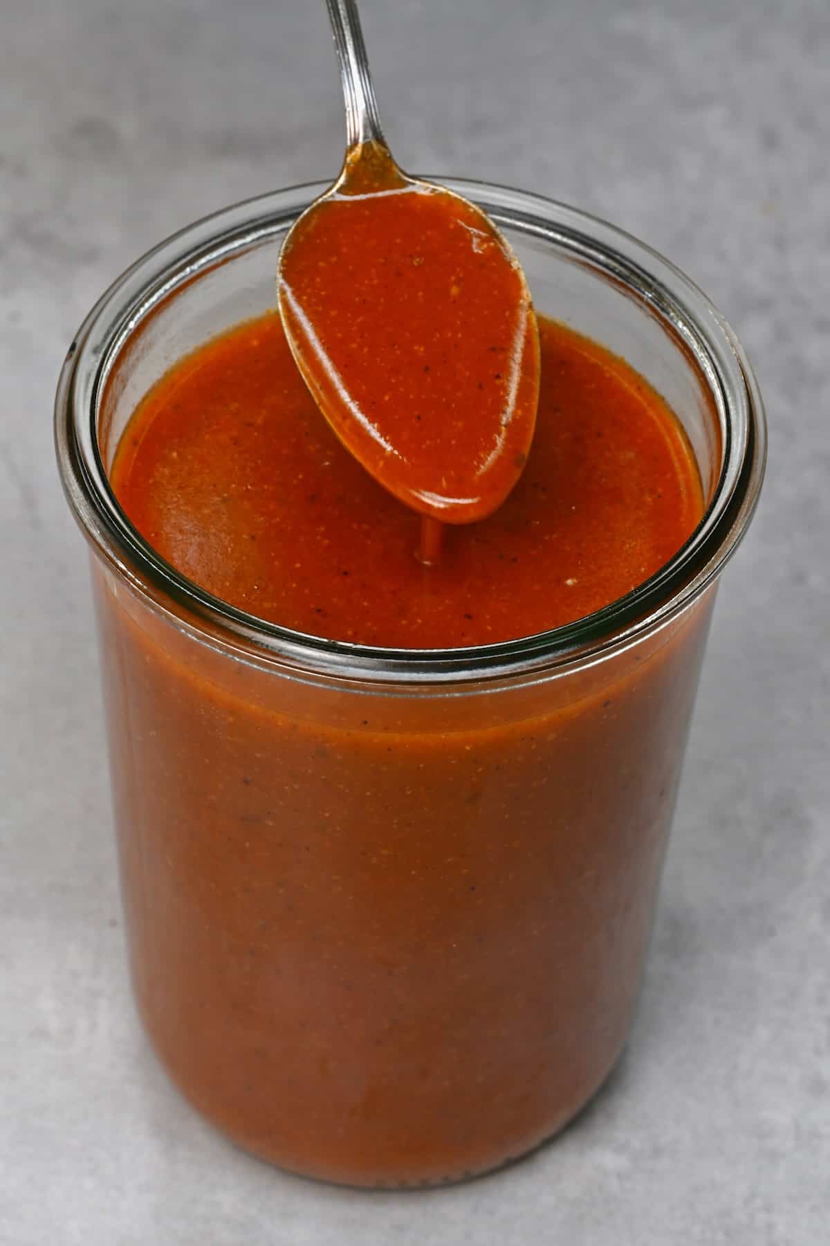 A spoonful of homemade enchilada sauce