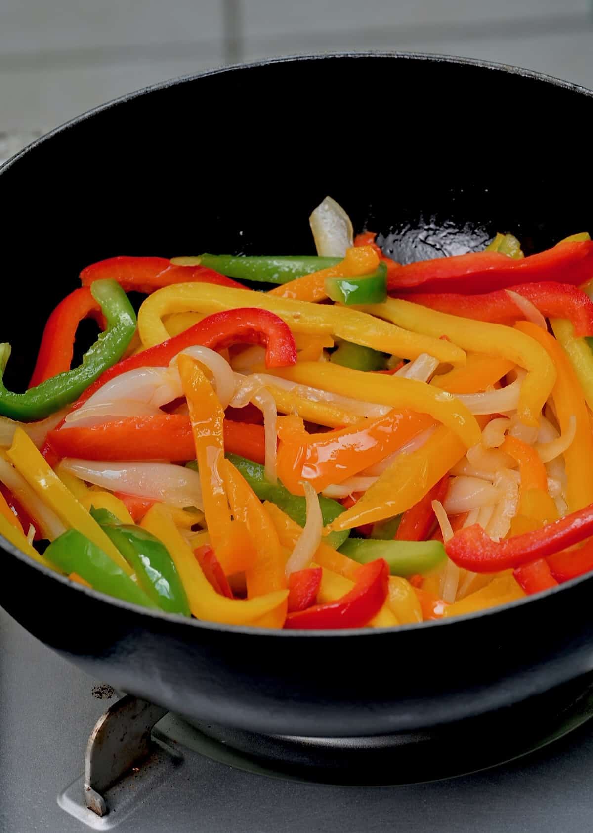 Cooked mixed color peppers in a wok