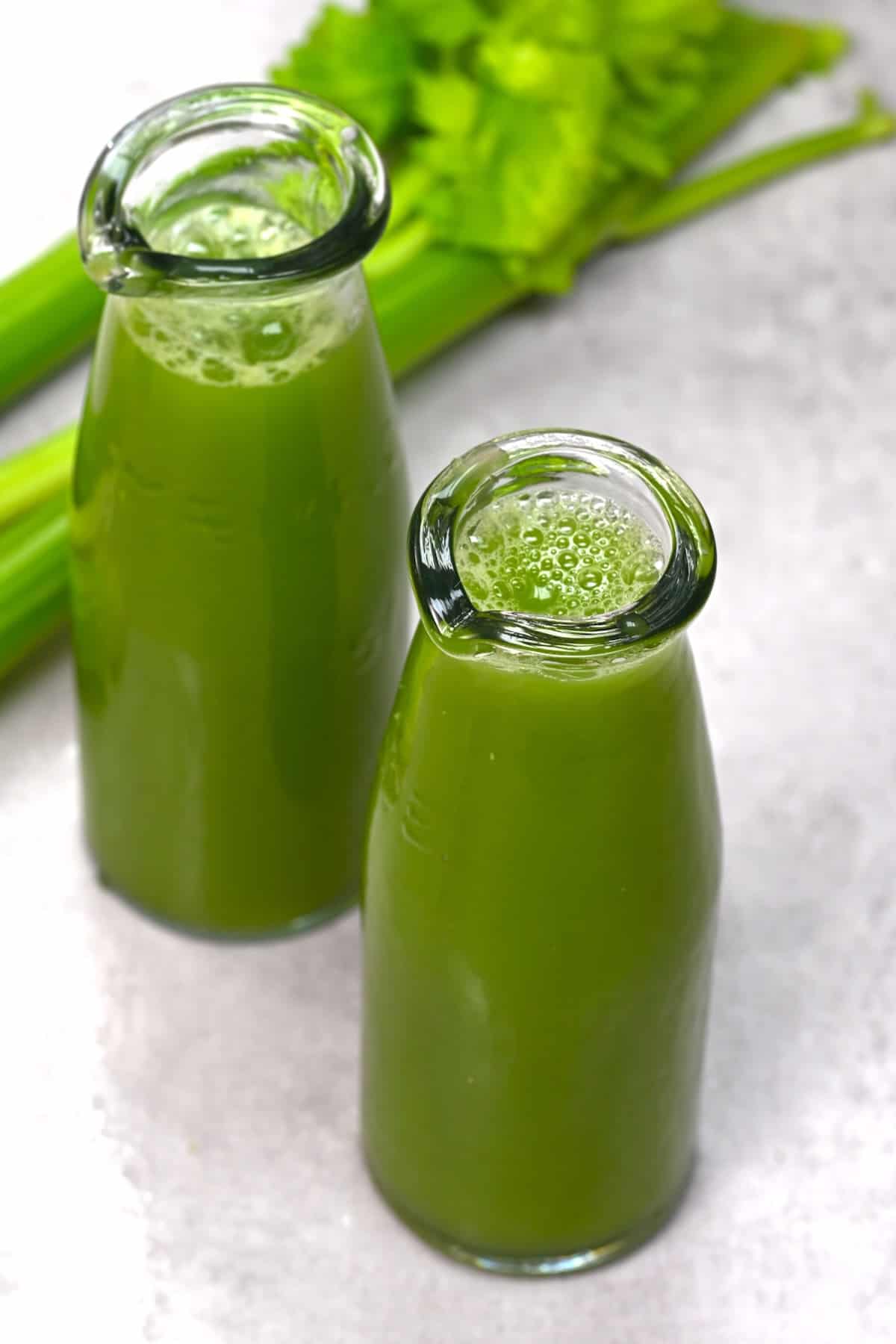 Two small bottles with celery juice