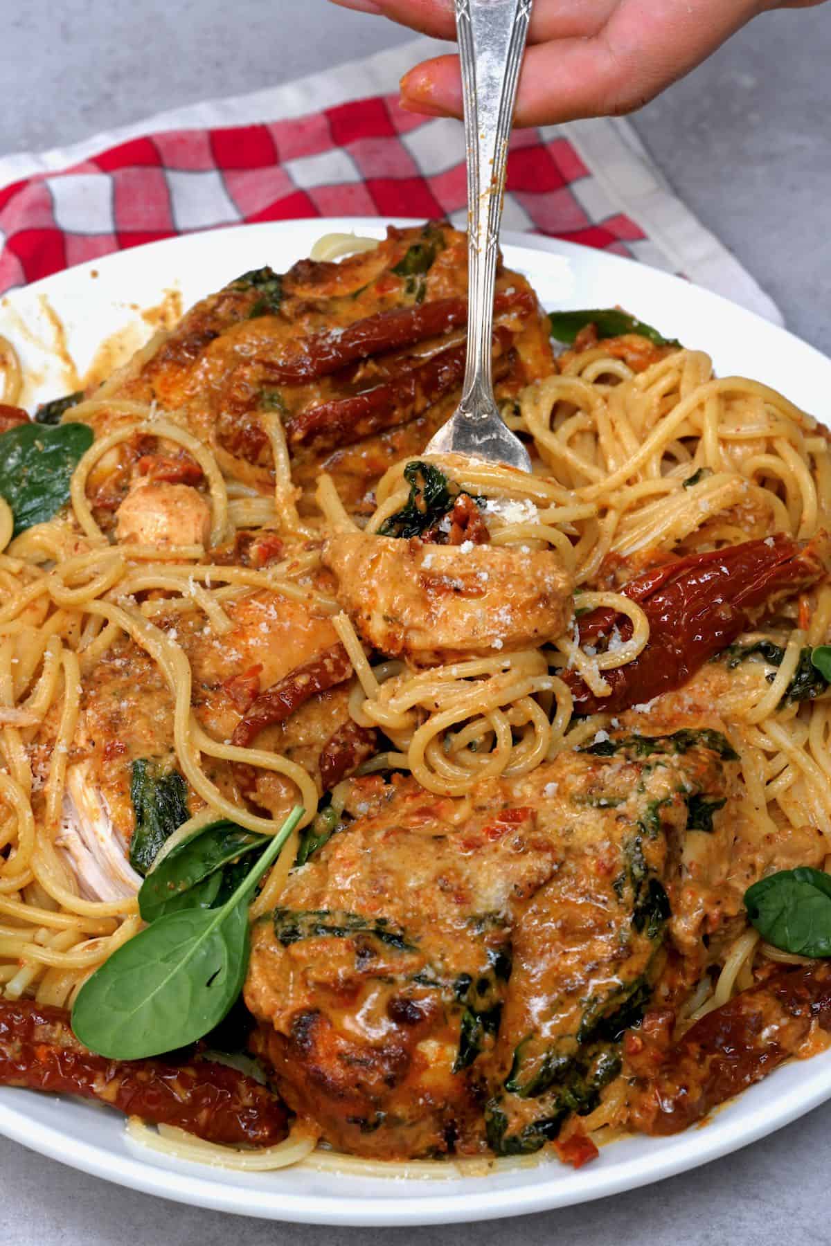 close up of spaghetti and Tuscan Chicken