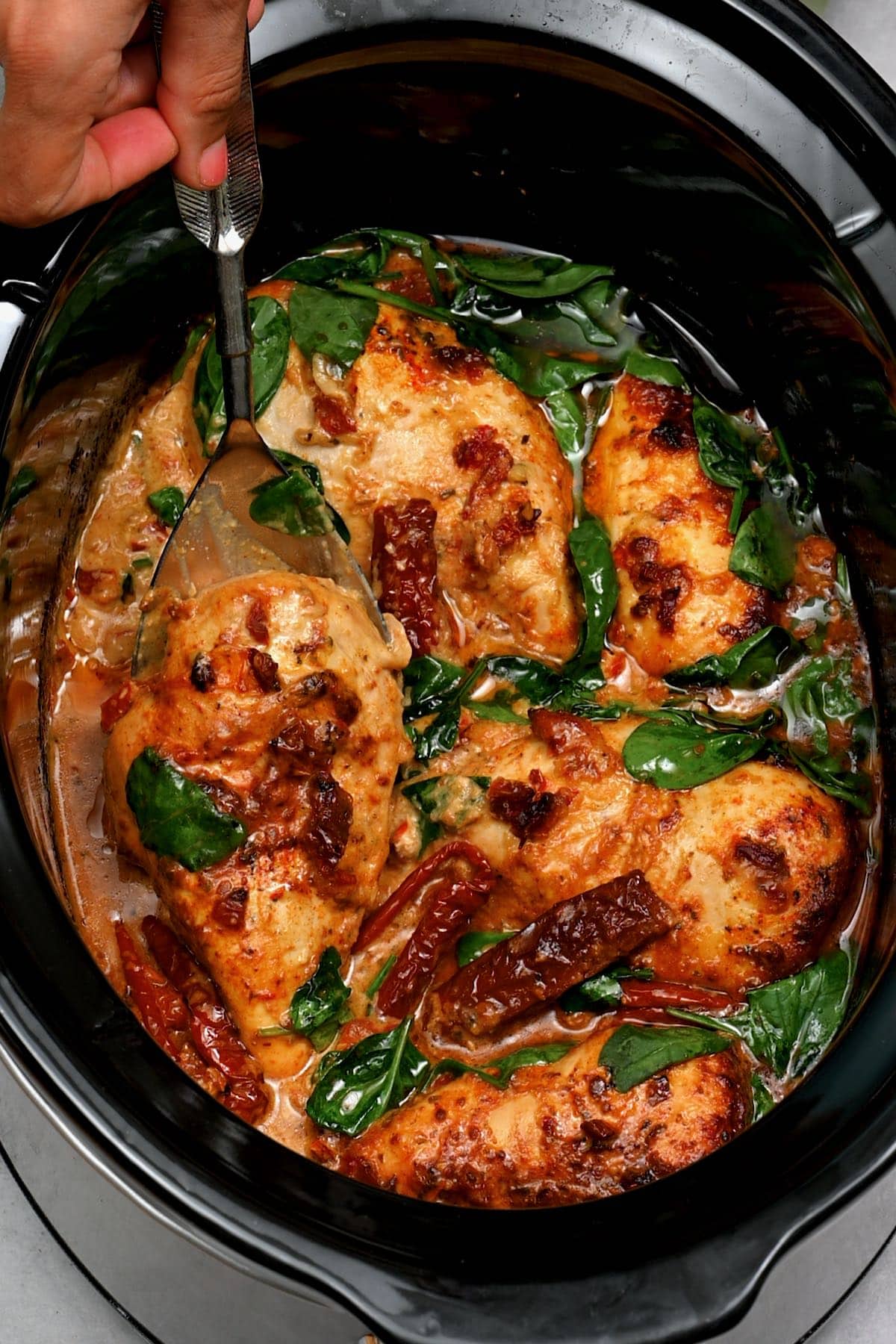 cooked Tuscan Chicken in a crock pot