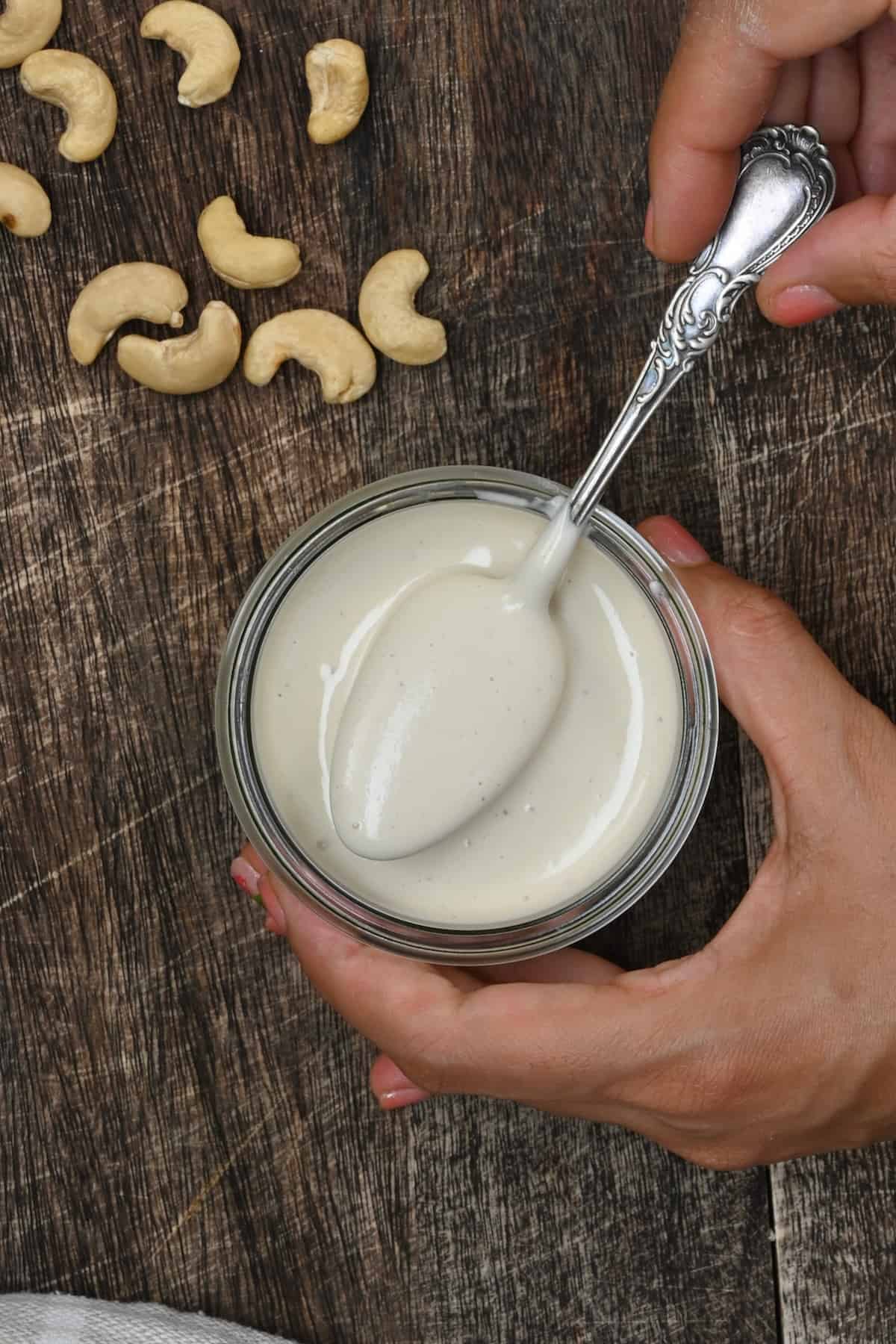 A spoonful of homemade cream made with cashews