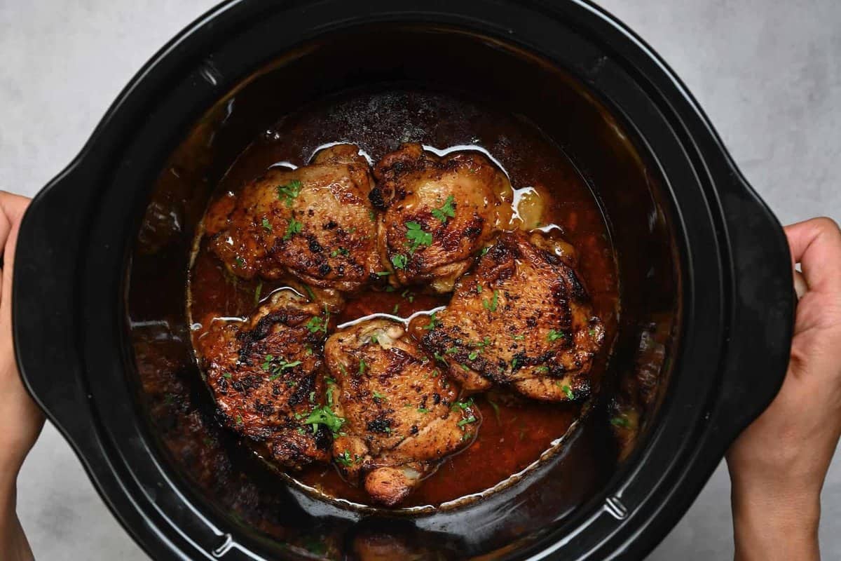 Chicken thighs cooked in a slow cooker