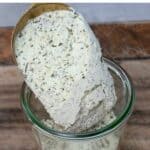 Filling a Container with Ranch Seasoning Using a Spoon