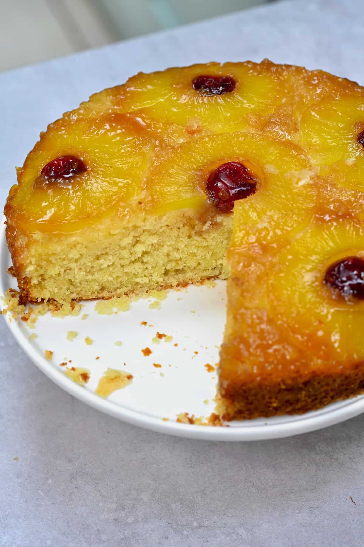 Pineapple upside down cake with a slice cut off