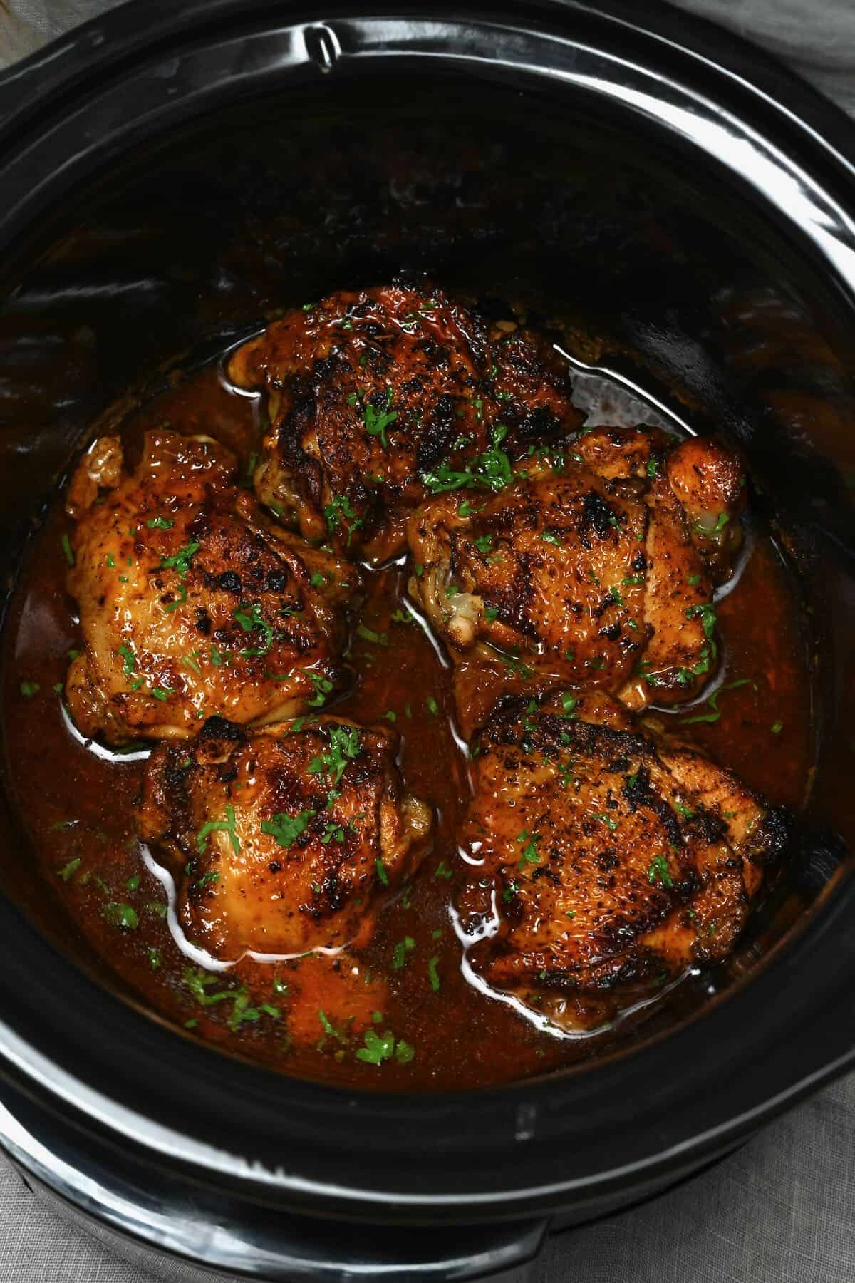 chicken thighs cooked inside a crock pot