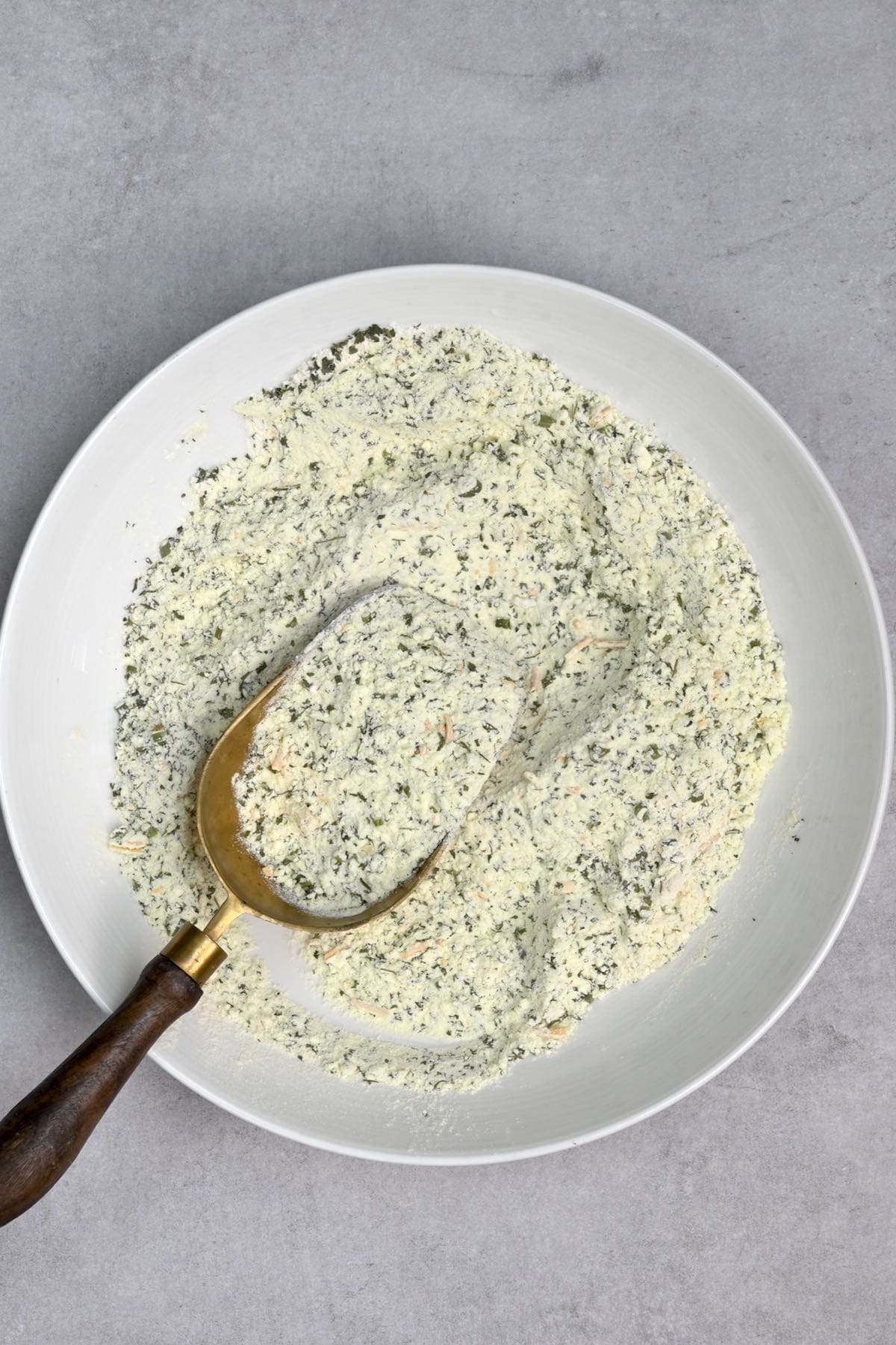 top view of ranch dressing dry mix on a white plate top
