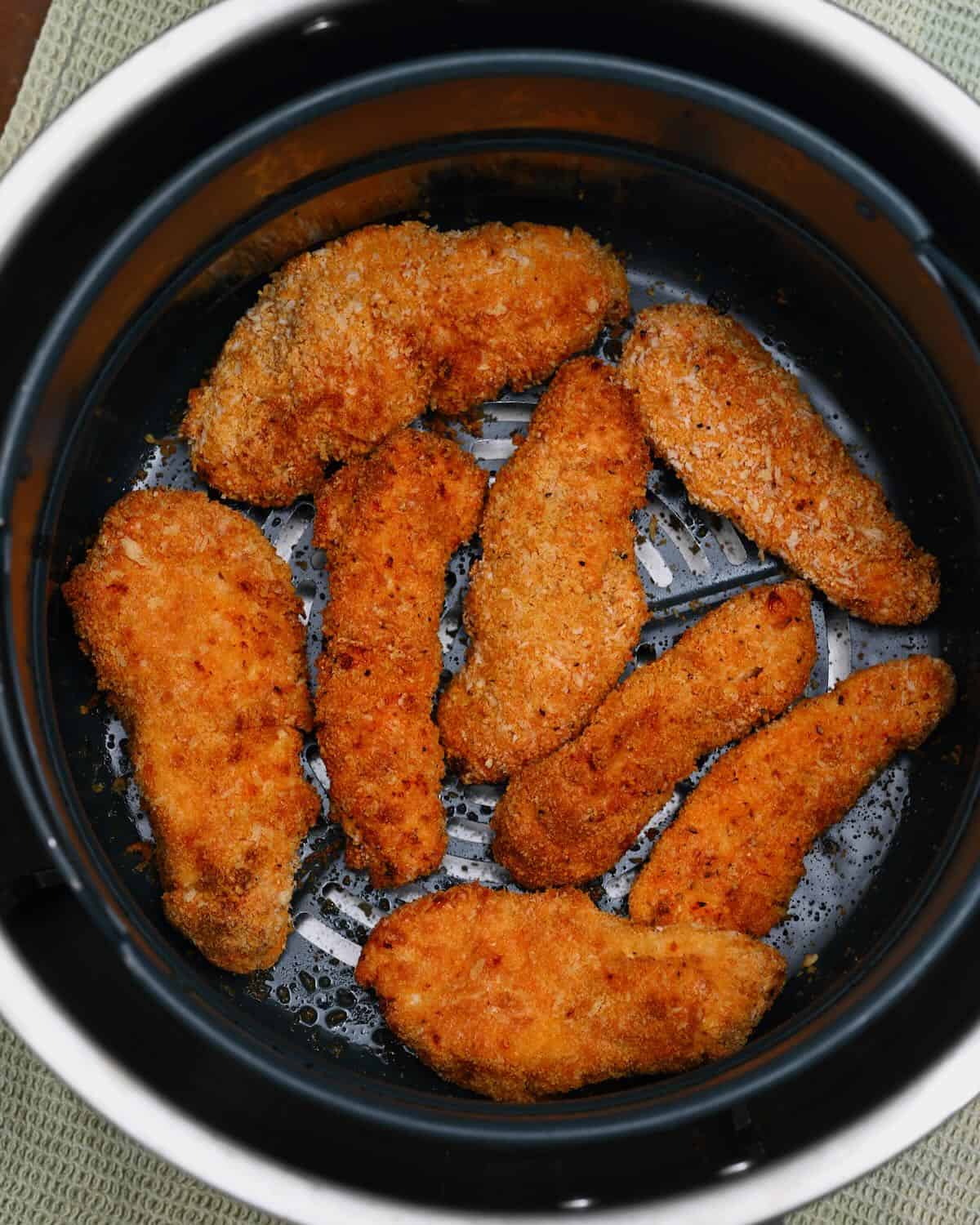 Freshly cooked chicken tenders in an air fryer
