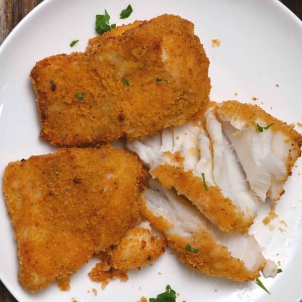Air fried fish on a white plate