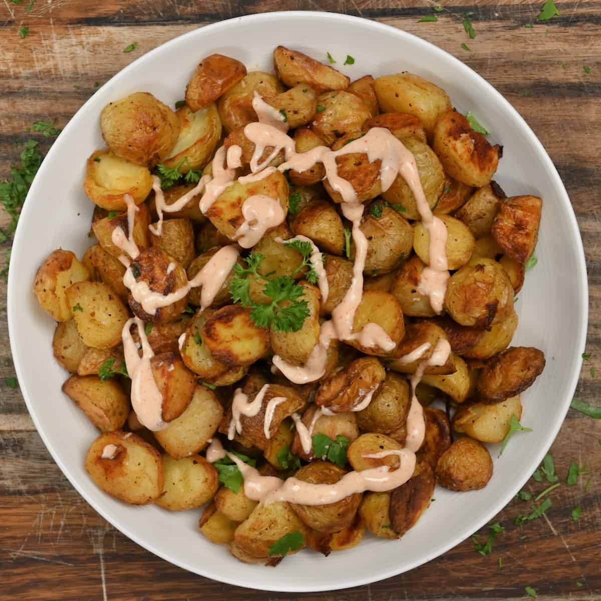 Crispy roasted potatoes served with sauce