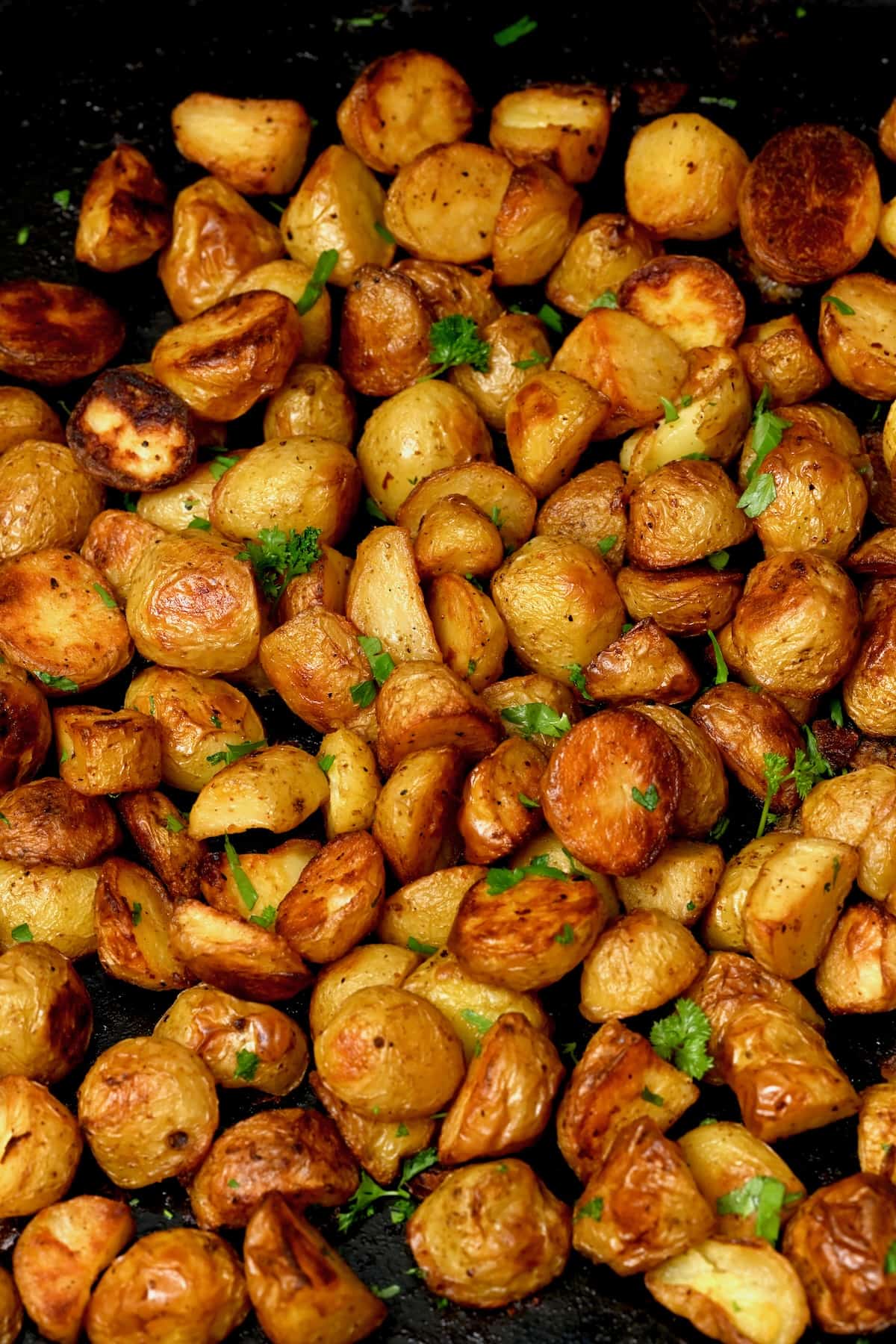 Oven roasted potatoes topped with parsley