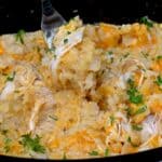 A forkful of chicken and rice cooked in crock pot