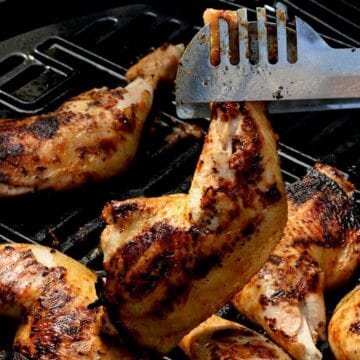 Grilled chicken quarters on the grill