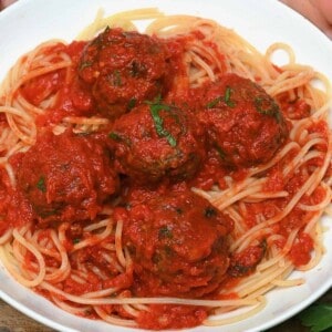 Italian meatballs served with spaghetti and tomato sauce