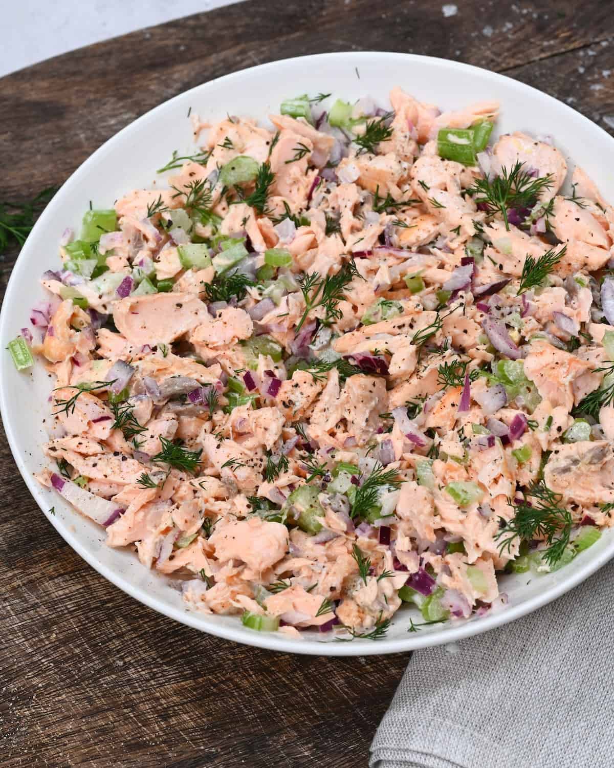 A bowl with salmon celery salad