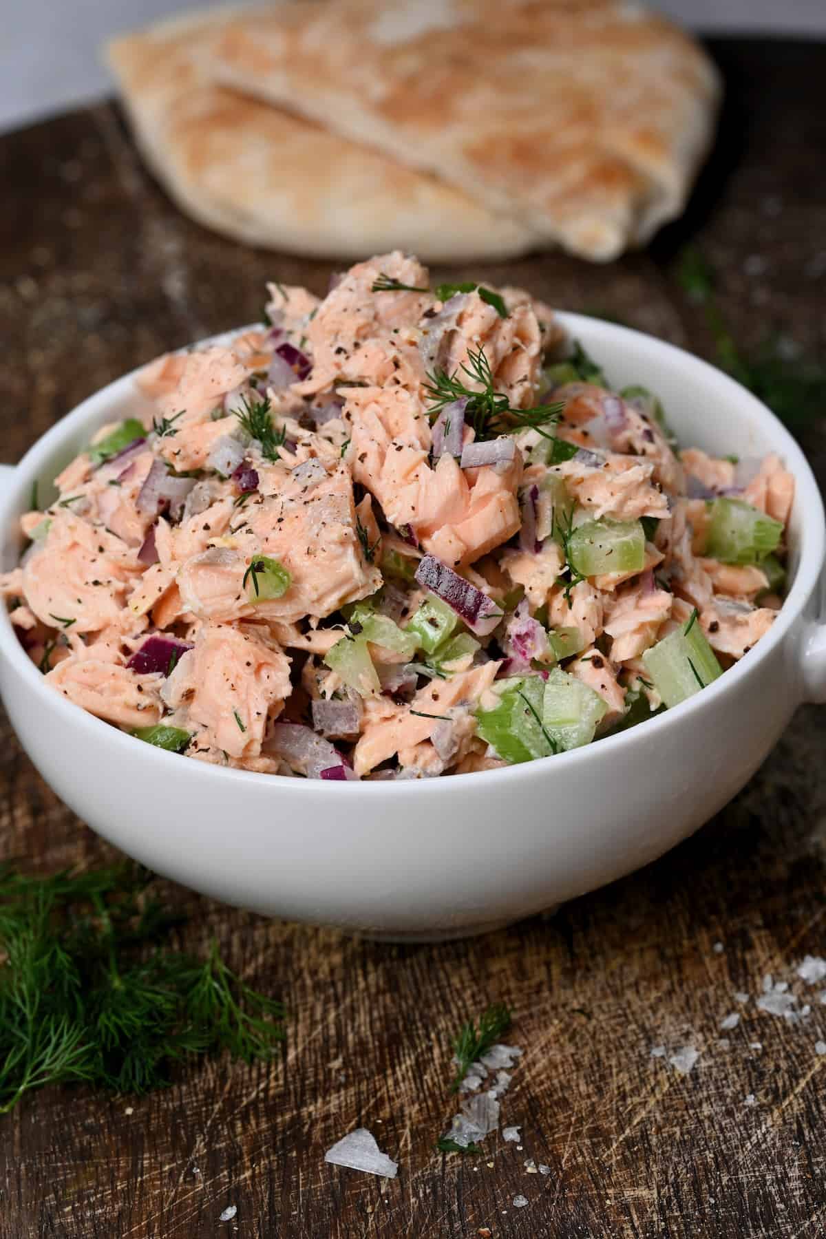 A bowl with salmon salad