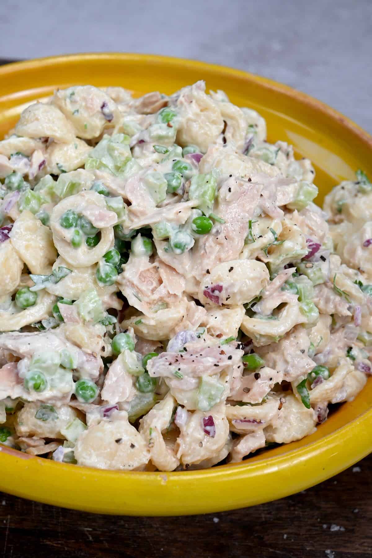 tuna pasta salad in a yellow plate