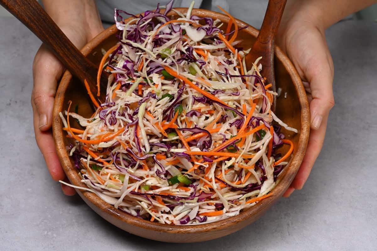 A serving bowl with shredded cabbage salad