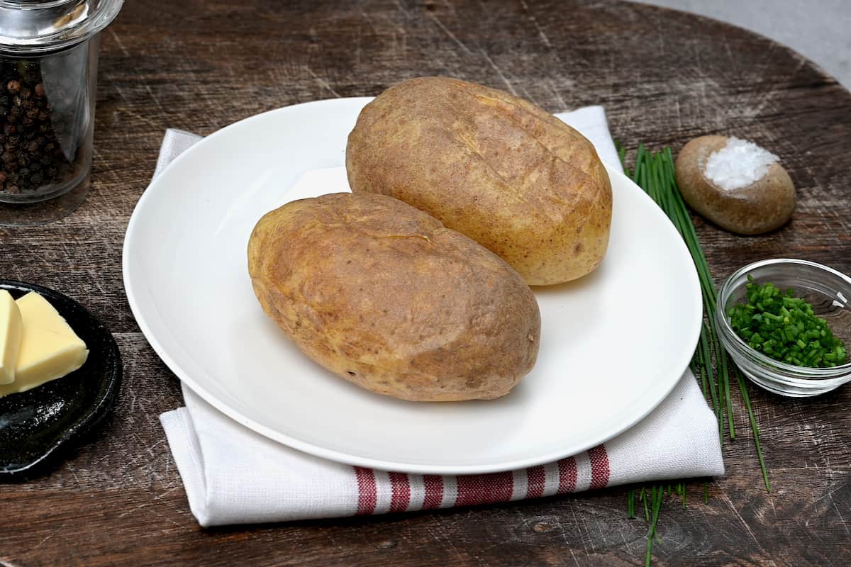 two microwave baked potatoes