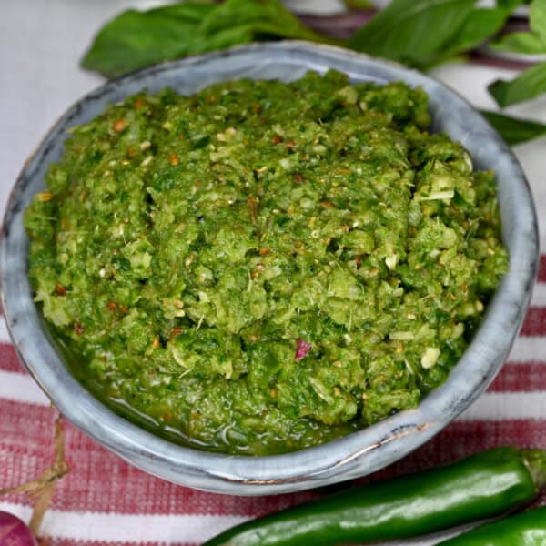 Homemade green curry paste in a small bowl