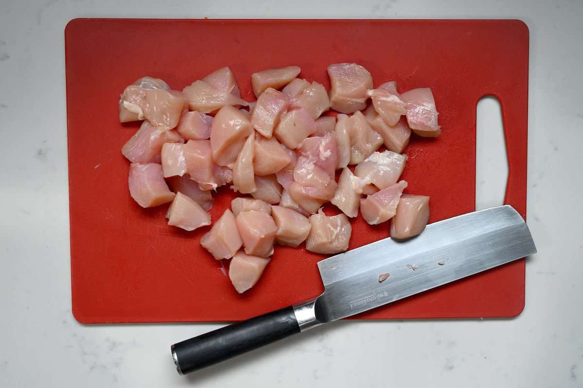 Chopped chicken breasts on a cutting board