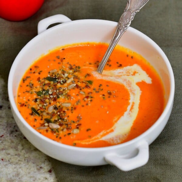 A bowl with tomato soup