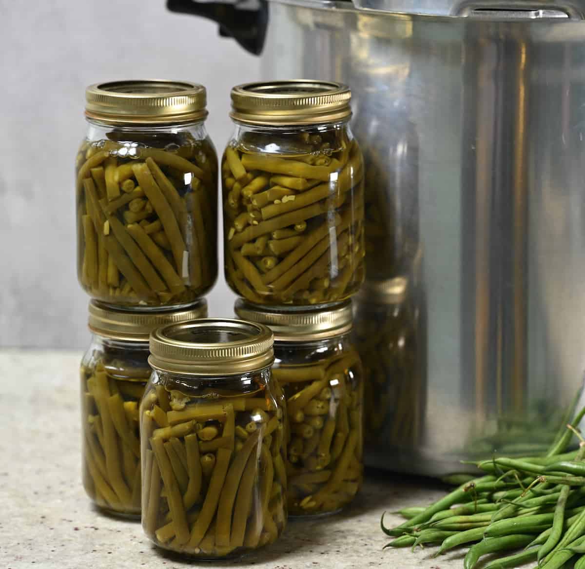 The green bean jars were checked for sealing.