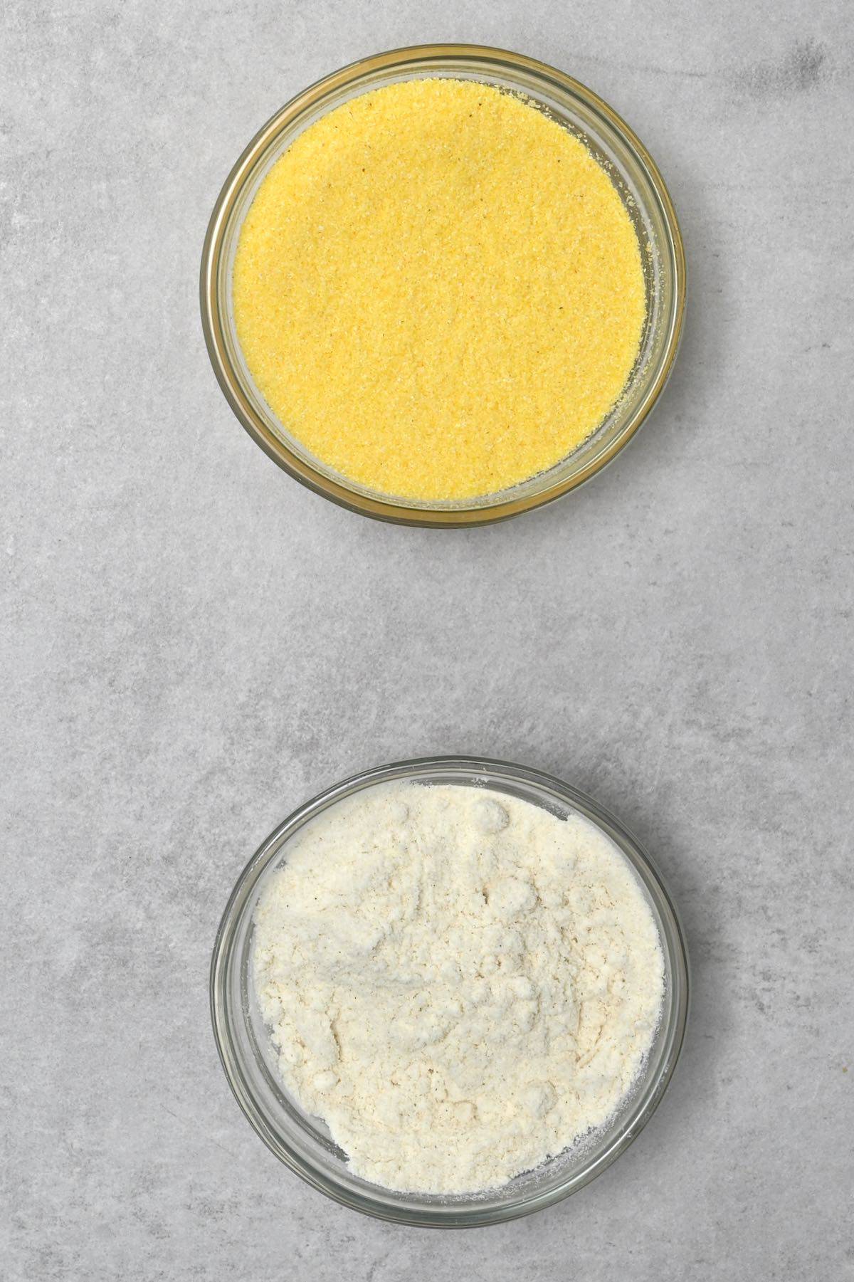 coconut flour next to cornmeal in glass bowl
