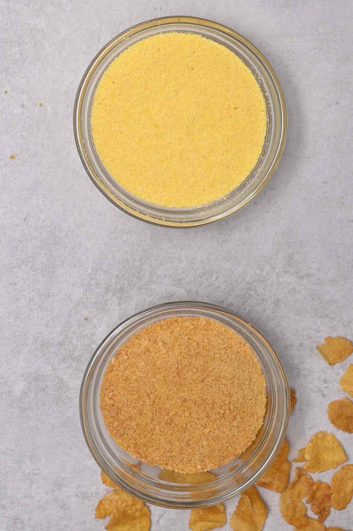 crushed cornflakes next to cornmeal in glass bowl