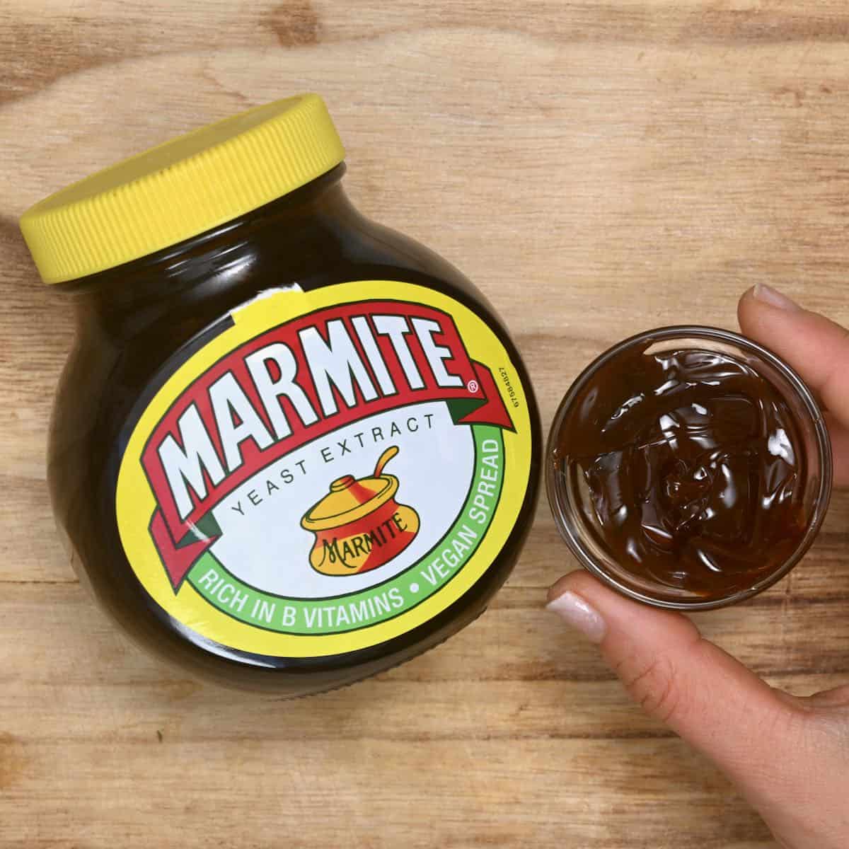 marmite in little cup next to marmite jar
