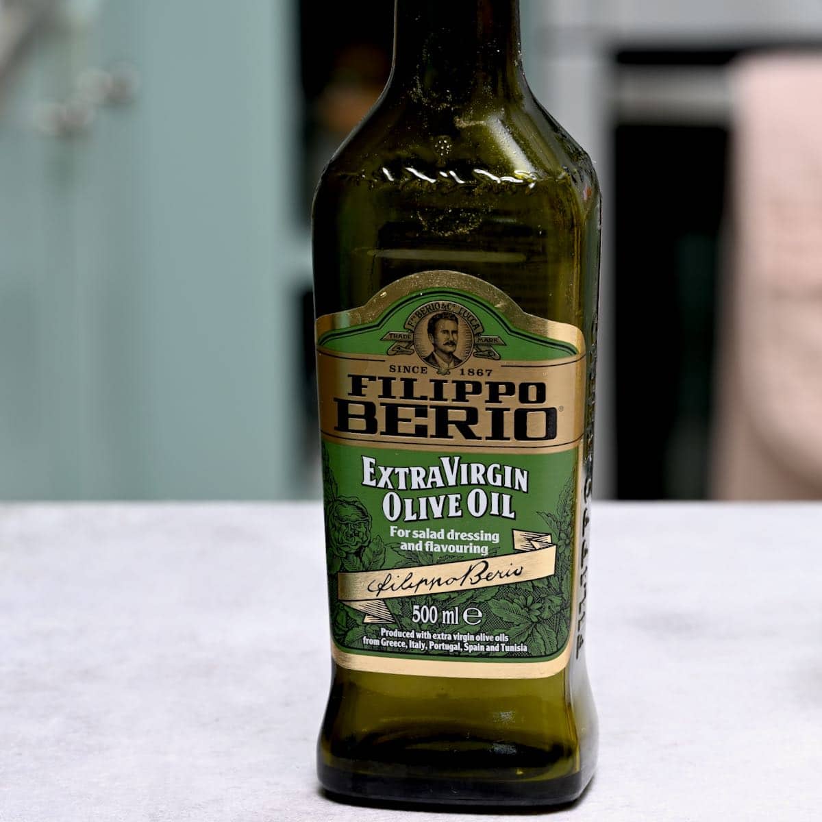 side view of a bottle of olive oil