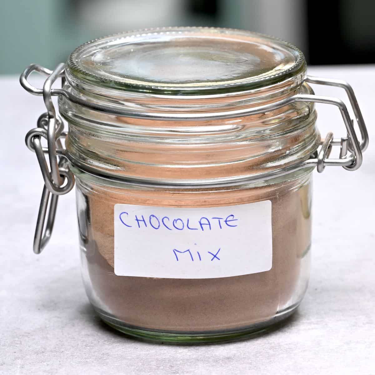 side view of hot choclate mix in a glass jar