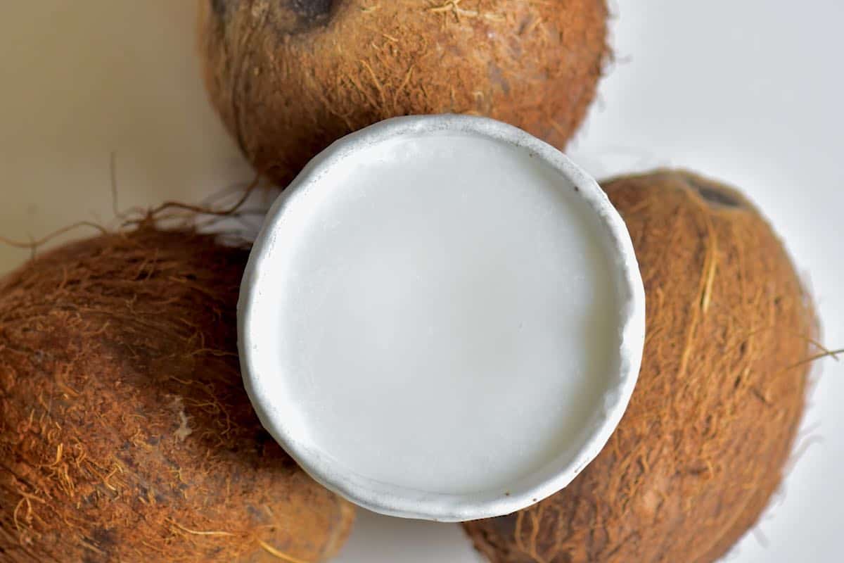 top view of coconut oil in a small white glass bowl