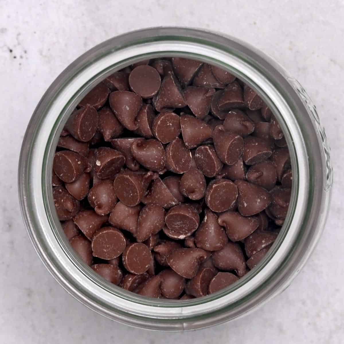 top view of milk chocolate chips in a jar