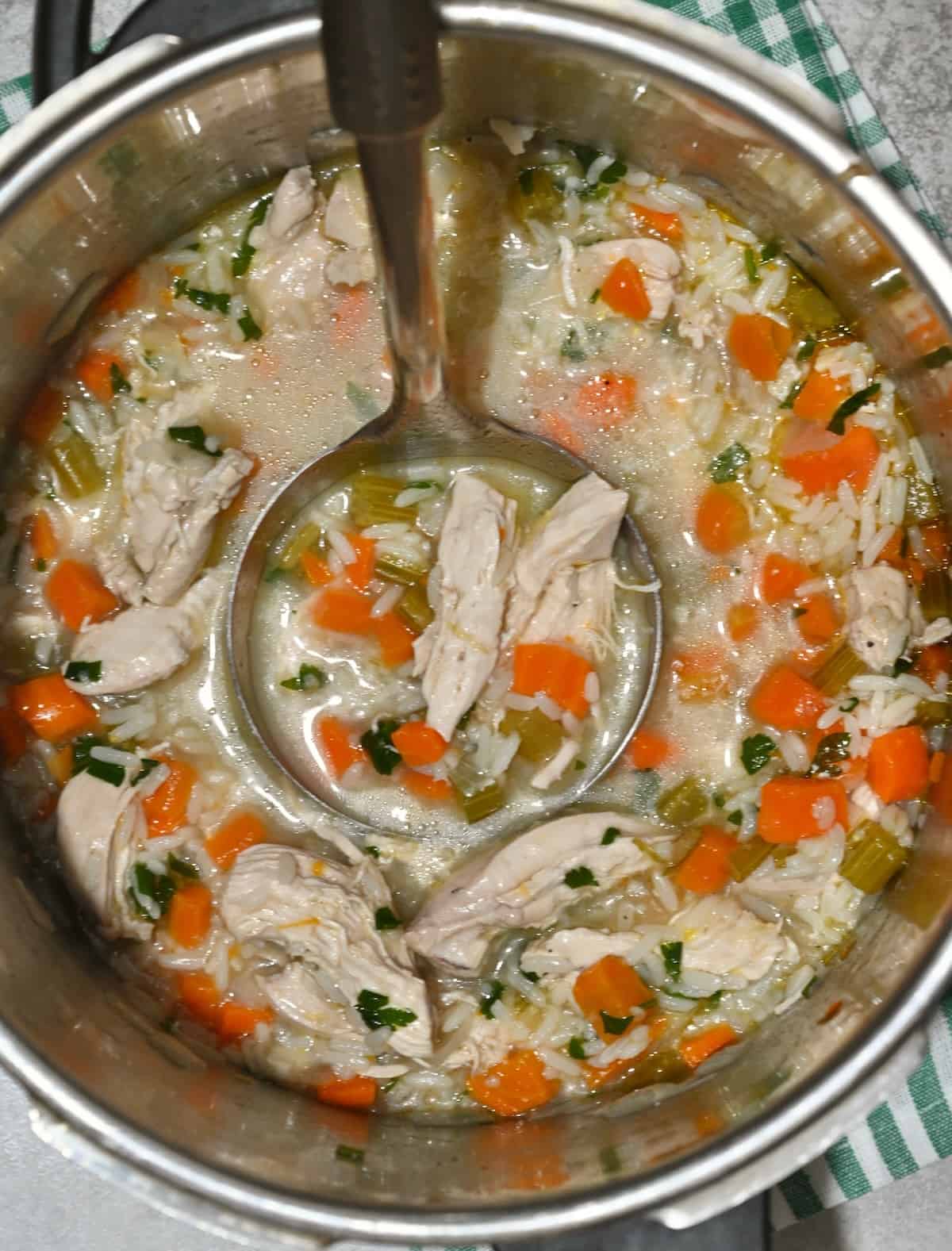 Homemade chicken and rice soup in a saucepan