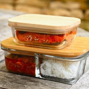 A set of glass food storage containers with bamboo lids