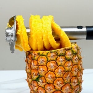 Pineapple corer and a cored pineapple