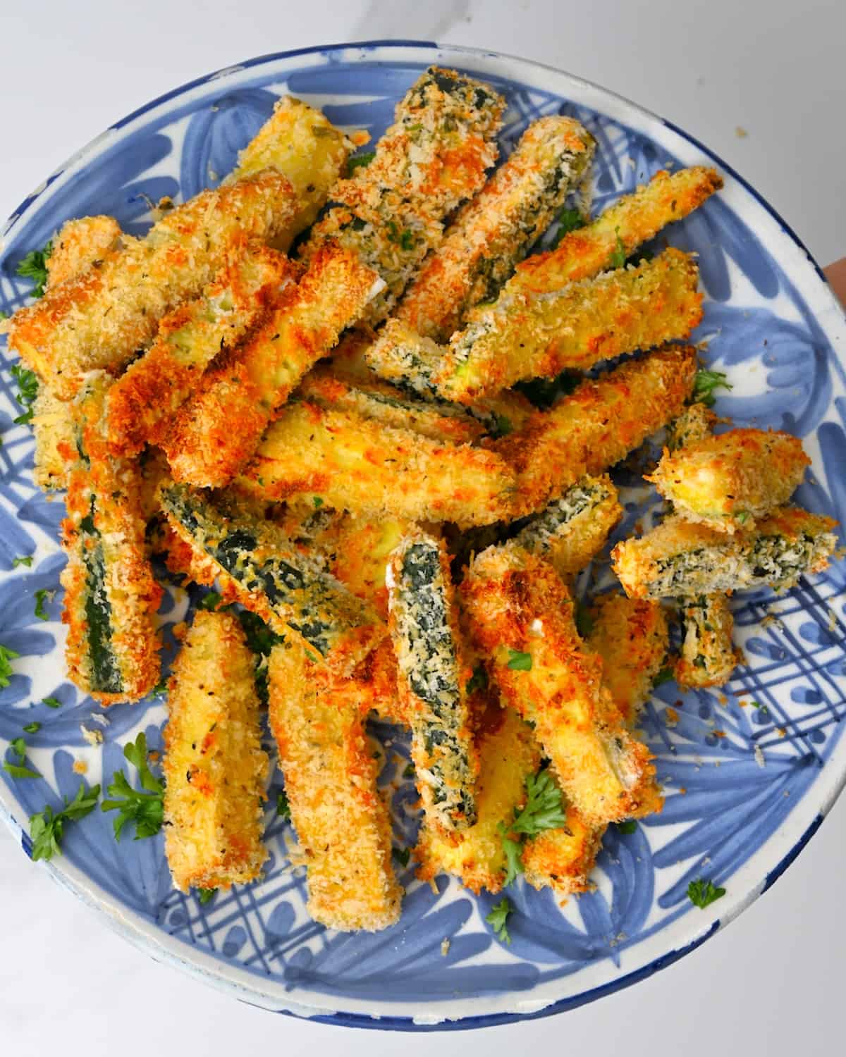 Air fried zucchini bites on a plate