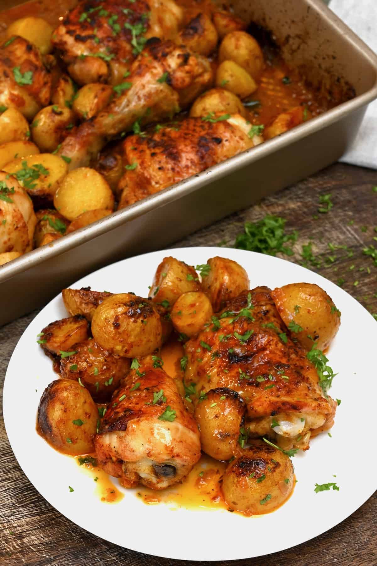 A serving of baked chicken and potatoes